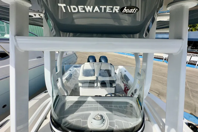 Slide: The Image of 2019 Tidewater 252 CC Adventure boat, showcasing helm and seating area. - 50