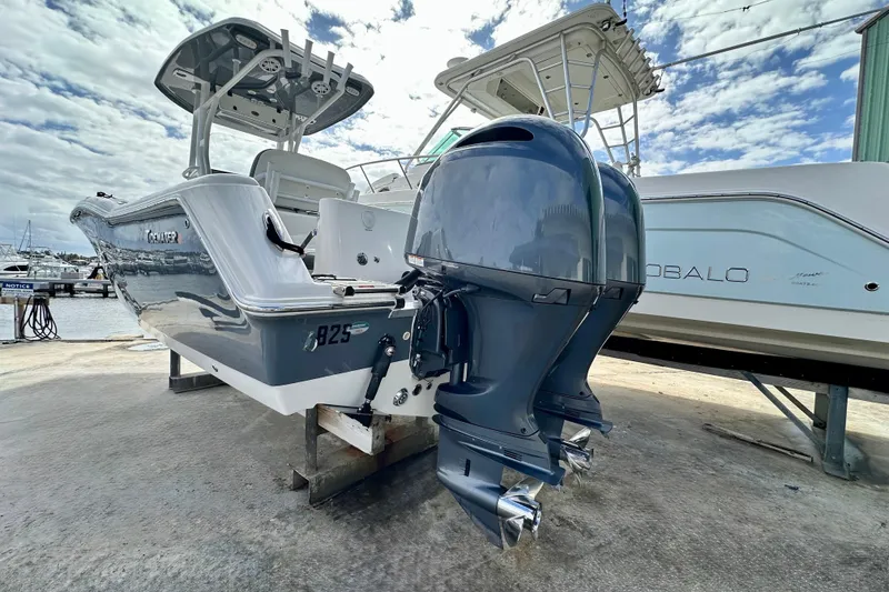 Slide: The Image of 2019 Tidewater 252 CC Adventure boat cruising on a sunny blue ocean. - 8