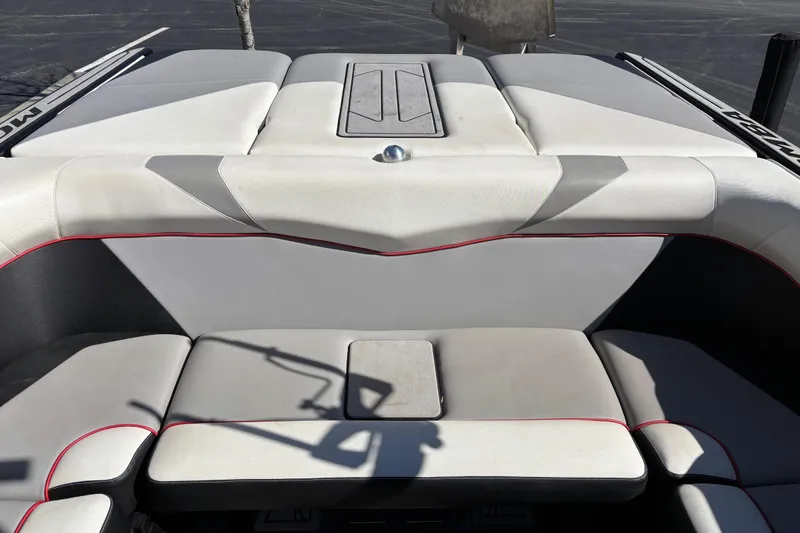 Slide: The Image of 2020 Moomba Craz boat interior with gray and white seating, red accents. - 14