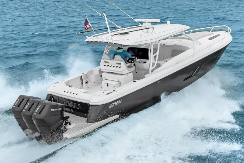 The Image of 2024 Intrepid 41 Valor boat cruising on ocean with triple Mercury engines. - 0