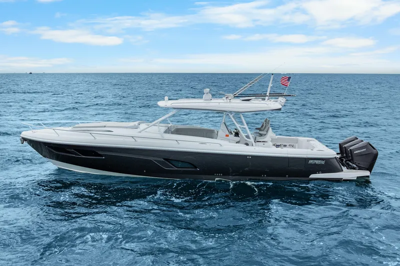 Slide: The Image of 2024 Intrepid 41 Valor boat cruising on open sea under clear blue sky. - 3