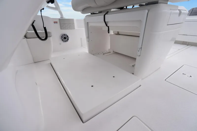 Slide: The Image of 2024 Intrepid 41 Valor boat interior with storage compartments and seating area. - 30