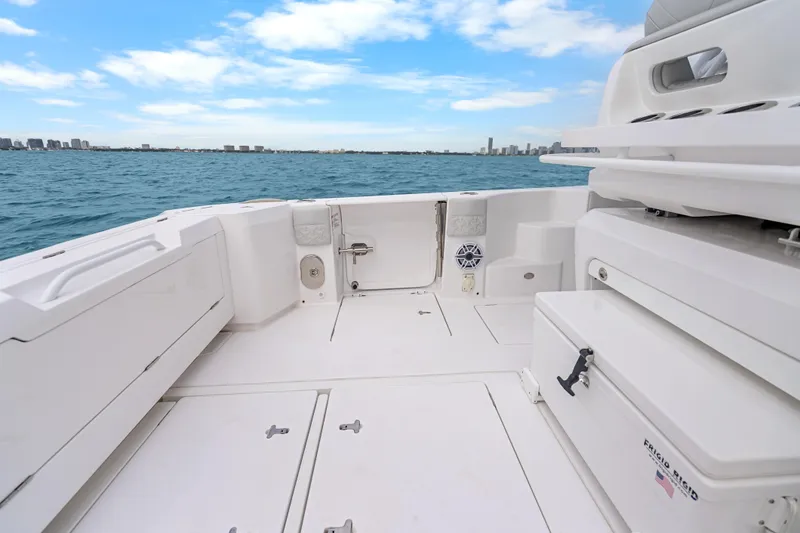 Slide: The Image of 2024 Intrepid 41 Valor boat deck with ocean view and city skyline. - 33