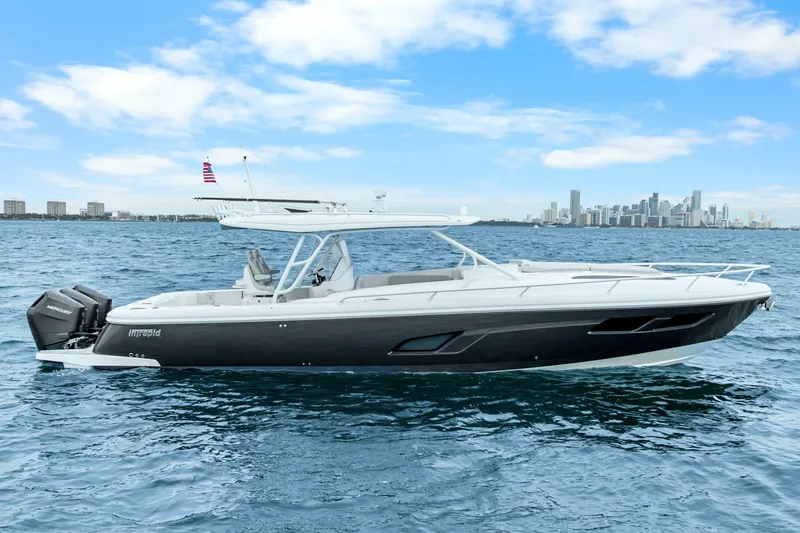 Slide: The Image of 2024 Intrepid 41 Valor boat on water with city skyline in background. - 4