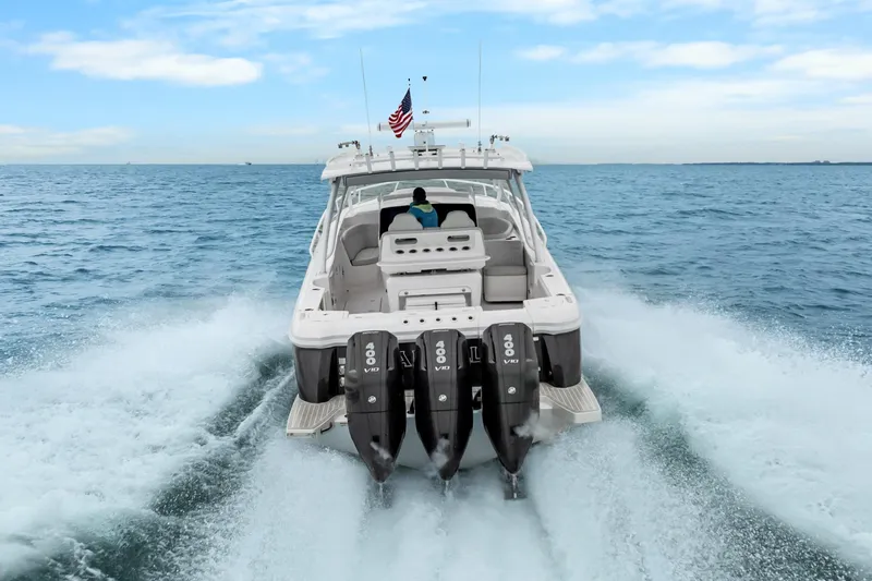 Slide: The Image of 2024 Intrepid 41 Valor boat cruising on open water with powerful engines. - 6