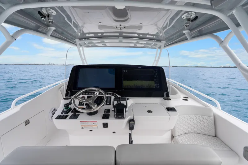 Slide: The Image of 2024 Intrepid 41 Valor helm with advanced navigation system on open water. - 8