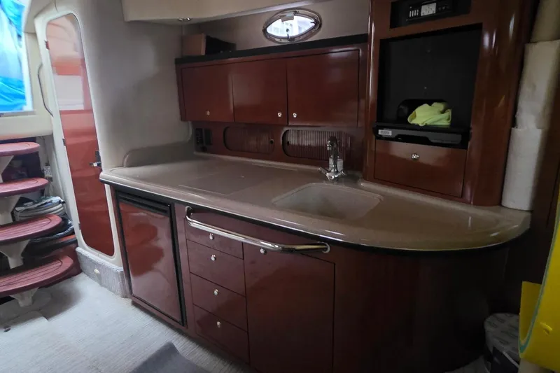 Slide: The Image of Luxurious 2004 Sea Ray 340 Sundancer yacht interior with plush seating and elegant design. - 13