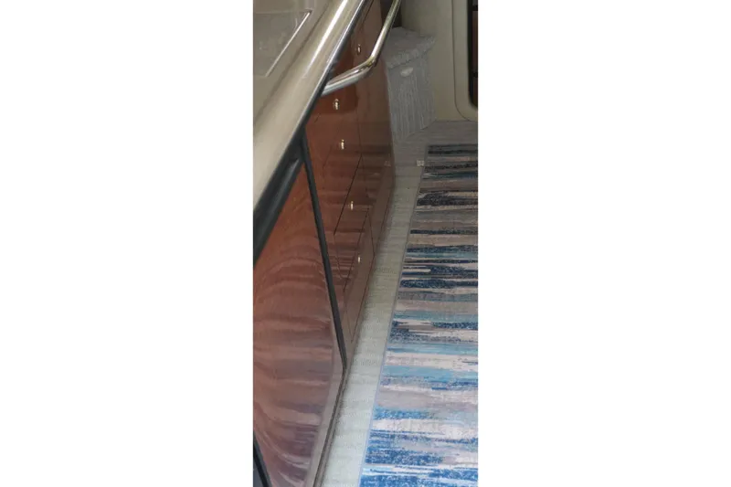 Slide: The Image of 2004 Sea Ray 340 Sundancer boat sink with faucet and cup holders. - 22