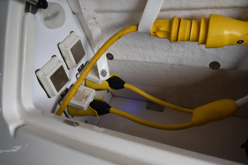 Slide: The Image of Luxurious 2004 Sea Ray 340 Sundancer boat interior with elegant seating and teak flooring. - 23