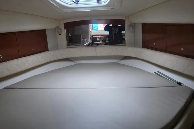 Slide: The Image of 2004 Sea Ray 340 Sundancer interior with wood flooring and seating area. - 24