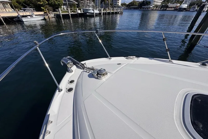 Slide: The Image of Bow of 2004 Sea Ray 340 Sundancer yacht docked in a marina. - 46