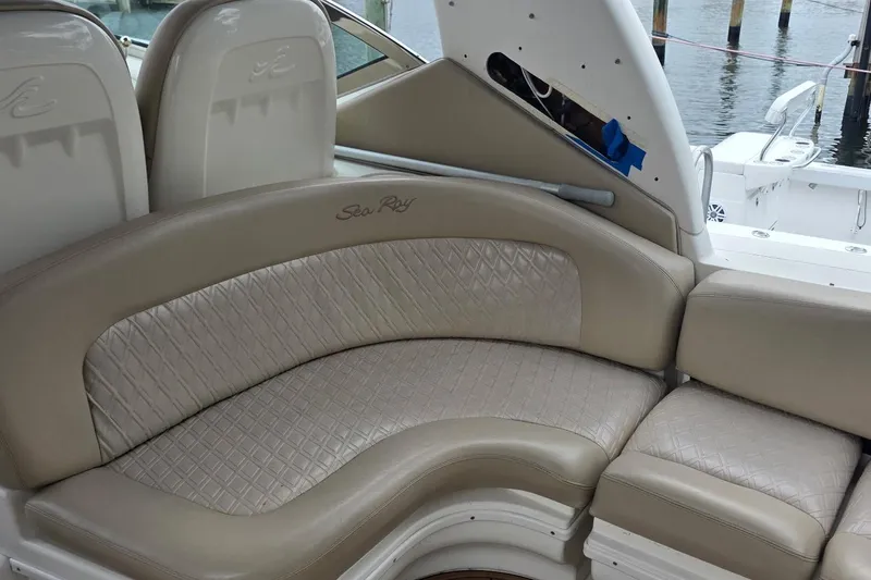 Slide: The Image of 2004 Sea Ray 340 Sundancer docked at marina under clear blue sky. - 5