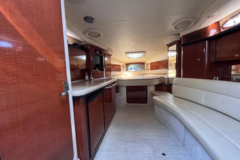 Slide: The Image of Luxurious interior of 2004 Sea Ray 340 Sundancer yacht with elegant wood finishes. - 54