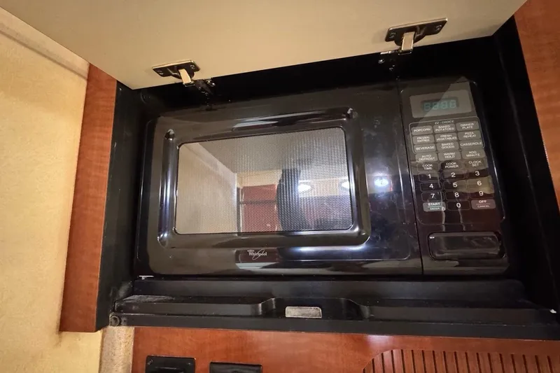 Slide: The Image of Microwave inside 2004 Sea Ray 340 Sundancer yacht kitchen cabinet. - 57