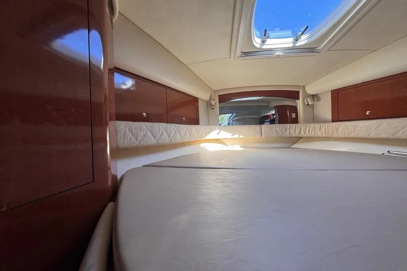 Slide: The Image of Interior cabin of 2004 Sea Ray 340 Sundancer with skylight and wooden cabinetry. - 61