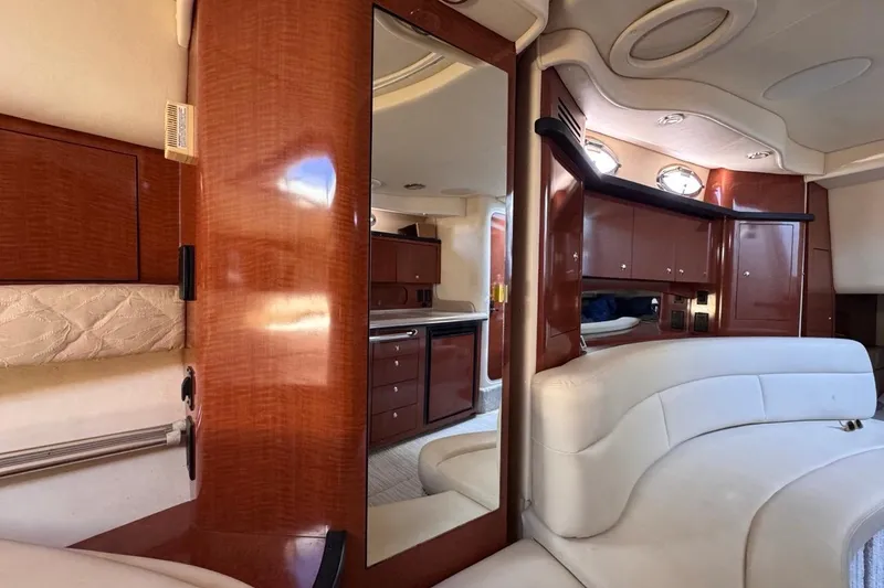 Slide: The Image of Luxurious interior of 2004 Sea Ray 340 Sundancer yacht with elegant wood finishes. - 64