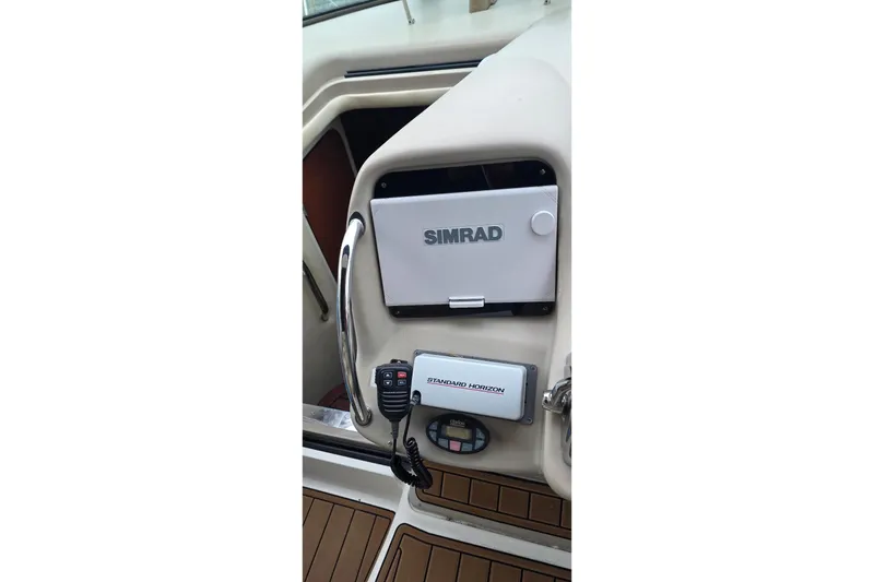 Slide: The Image of 2004 Sea Ray 340 Sundancer docked in sunny marina with palm trees. - 7