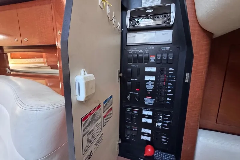 Slide: The Image of Electrical control panel inside 2004 Sea Ray 340 Sundancer yacht cabin. - 70