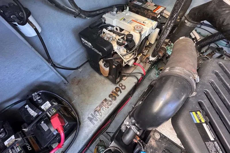 Slide: The Image of Engine room of 2004 Sea Ray 340 Sundancer with Kohler power system and batteries. - 82