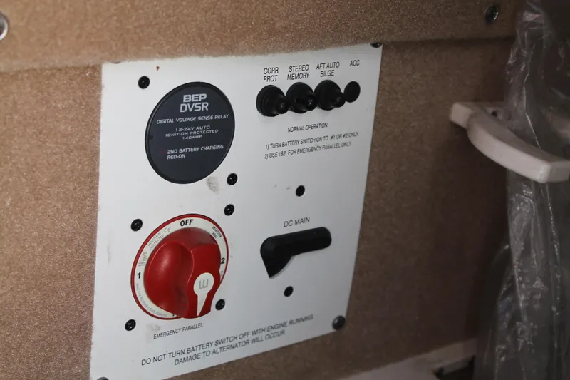 Slide: The Image of Control panel of a 2015 Chaparral 224 Sunesta boat with battery switches and indicators. - 45