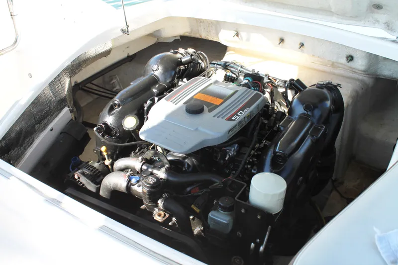 Slide: The Image of Engine compartment of 2015 Chaparral 224 Sunesta boat, showcasing a powerful 5.0L engine. - 50