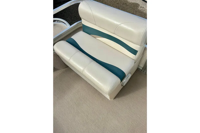 Slide: The Image of Sun Tracker Party Barge 20 Classic Series 2010 boat seat, white with teal accents. - 16