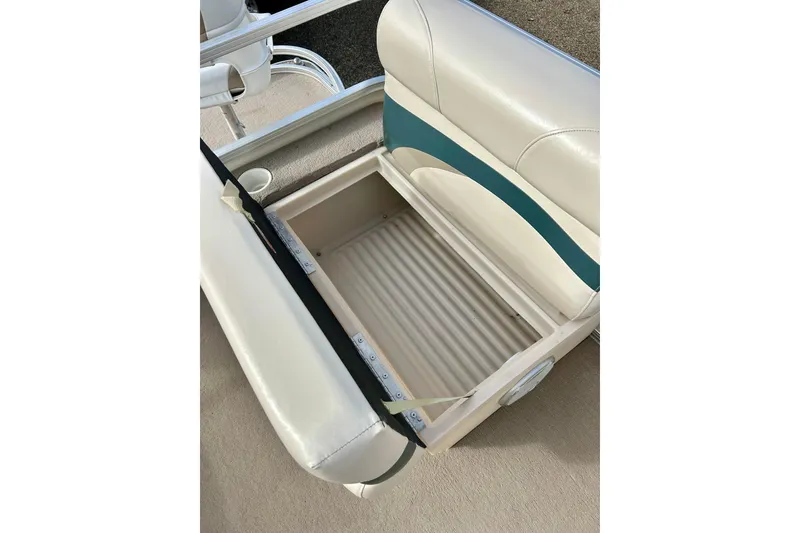 Slide: The Image of Open storage compartment on 2010 Sun Tracker Party Barge 20 Classic Series boat seat. - 17