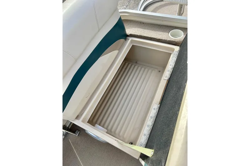 Slide: The Image of Open storage compartment on 2010 Sun Tracker Party Barge 20 Classic Series boat. - 18