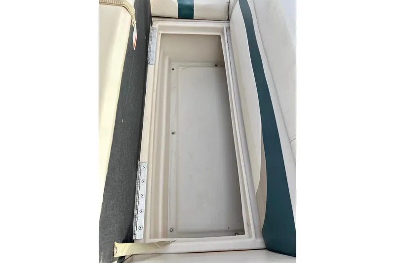 Slide: The Image of Open storage compartment on 2010 Sun Tracker Party Barge 20 Classic Series boat. - 22