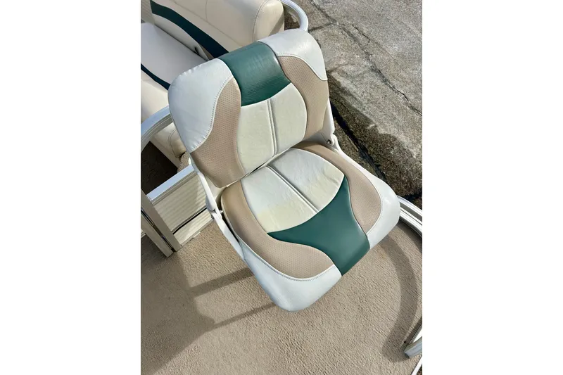 Slide: The Image of 2010 Sun Tracker Party Barge 20 Classic Series boat seat, beige and green upholstery. - 31
