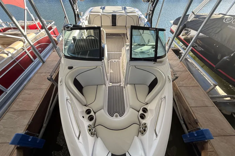 Slide: The Image of 2010 Nautique Super Air Nautique 210 boat interior with steering wheel and dashboard controls. - 20