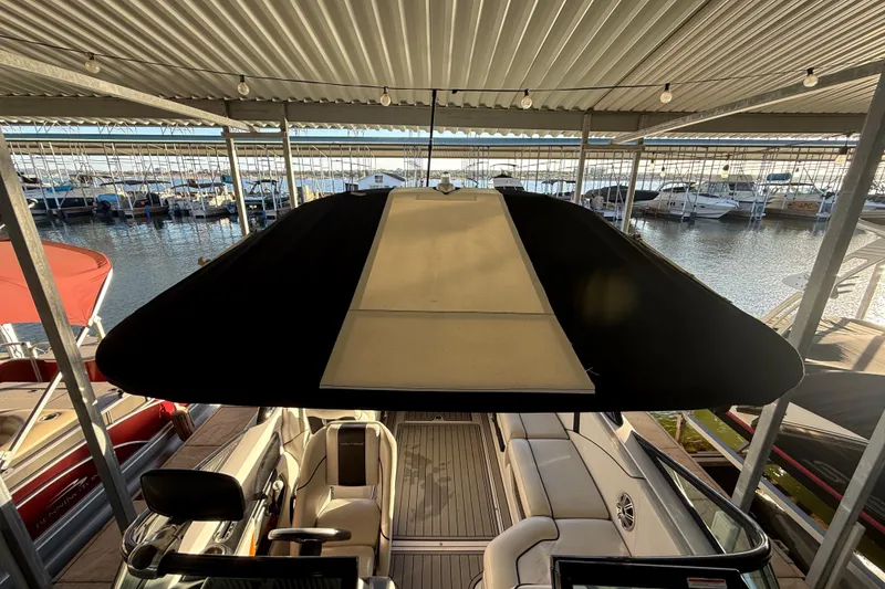 Slide: The Image of 2010 Nautique Super Air Nautique 210 dashboard with Clarion stereo system. - 26