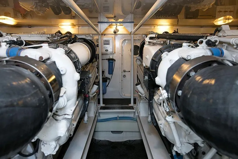 Slide: The Image of Engine room of a 2003 Viking 65 Convertible yacht, showcasing dual engines and mechanical systems. - 5