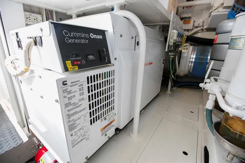 Slide: The Image of Cummins Onan generator in 2003 Viking 65 Convertible yacht engine room. - 6