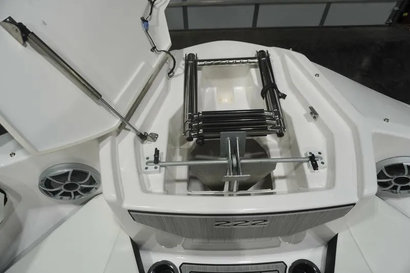 Slide: The Image of 2024 Yamaha Boats 222SD bow storage with ladder and speakers. - 11