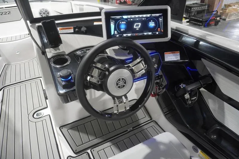 Slide: The Image of 2024 Yamaha Boats 222SD dashboard with steering wheel and digital display. - 22