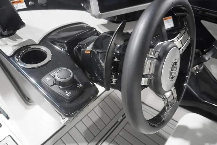 Slide: The Image of 2024 Yamaha Boats 222SD steering wheel and control panel, featuring sleek design and modern technology. - 23