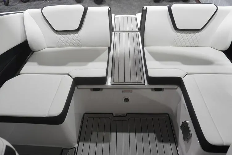 Slide: The Image of 2024 Yamaha Boats 222SD interior seating with sleek white upholstery and modern design. - 27