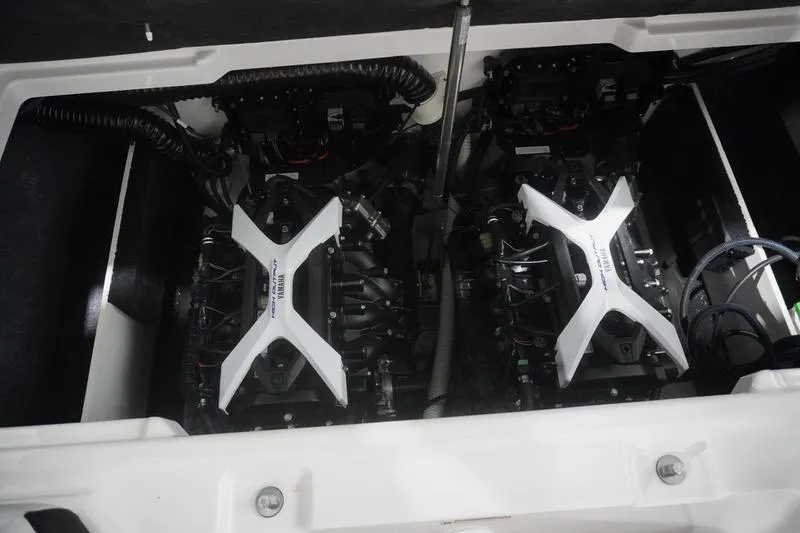 Slide: The Image of 2024 Yamaha Boats 222SD engine compartment with dual engines and white covers. - 31
