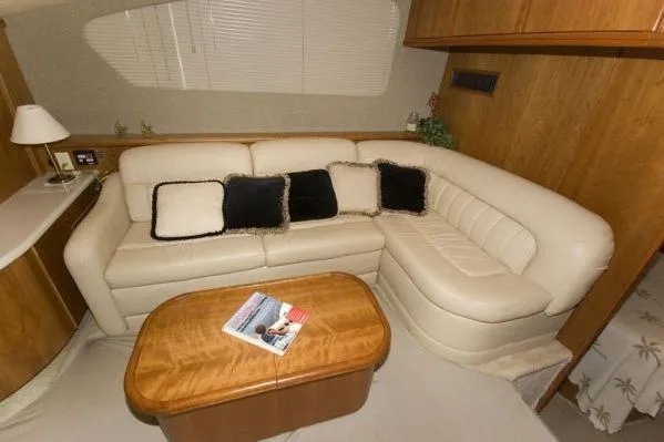 Slide: The Image of Luxurious interior of 2003 Silverton 39 Motor Yacht with cream leather seating and wooden table. - 15