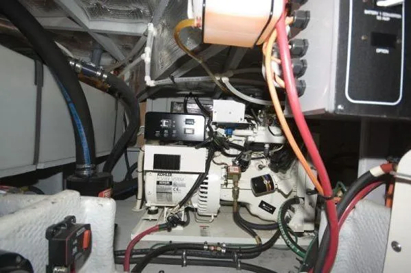 Slide: The Image of Engine room of 2003 Silverton 39 Motor Yacht with visible wiring and machinery. - 18