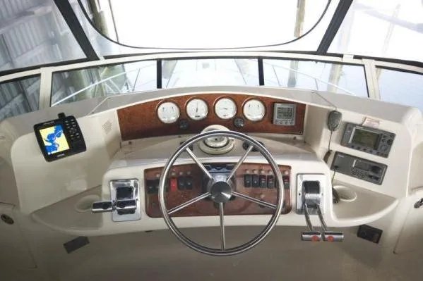 Slide: The Image of 2003 Silverton 39 Motor Yacht helm with steering wheel and navigation instruments. - 4