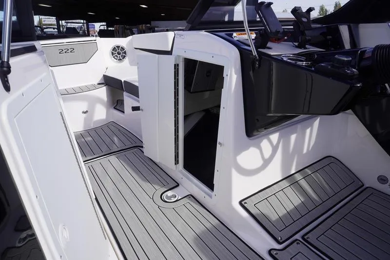 Slide: The Image of 2024 Yamaha Boats 222S interior with sleek seating and modern dashboard design. - 18