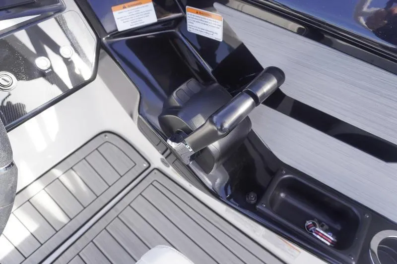 Slide: The Image of 2024 Yamaha Boats 222S throttle control and dashboard detail. - 24
