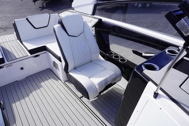 Slide: The Image of 2024 Yamaha Boats 222S interior with luxurious seating and sleek design. - 26