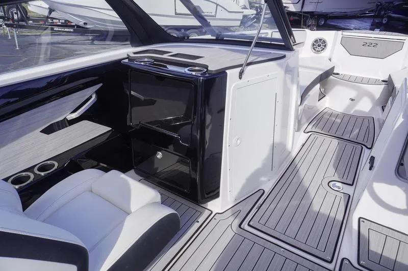 Slide: The Image of 2024 Yamaha Boats 222S interior with sleek seating and modern dashboard design. - 27