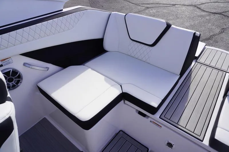 Slide: The Image of 2024 Yamaha Boats 222S interior seating with white upholstery and modern design. - 31