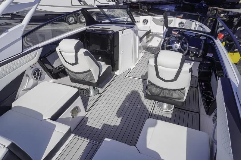 Slide: The Image of 2024 Yamaha Boats 222S interior with sleek seating and modern dashboard design. - 6