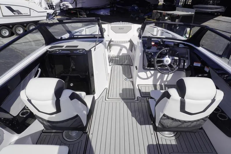 Slide: The Image of 2024 Yamaha Boats 222S interior with sleek seating and modern dashboard design. - 7