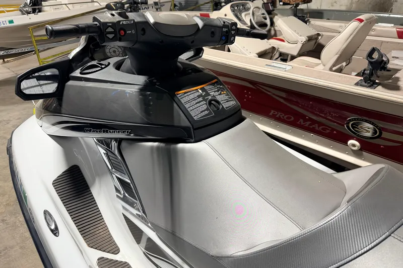 Slide: The Image of 2015 Yamaha WaveRunner FX Cruiser HO in a showroom, showcasing sleek design and controls. - 13